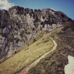 Person climbing steep hill