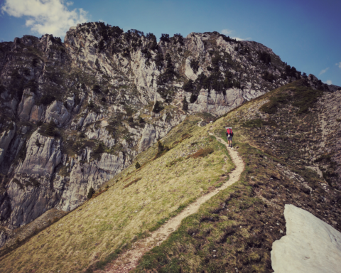 Person climbing steep hill
