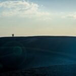 Hill with two people in the distance talking