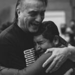 People hugging after water baptism