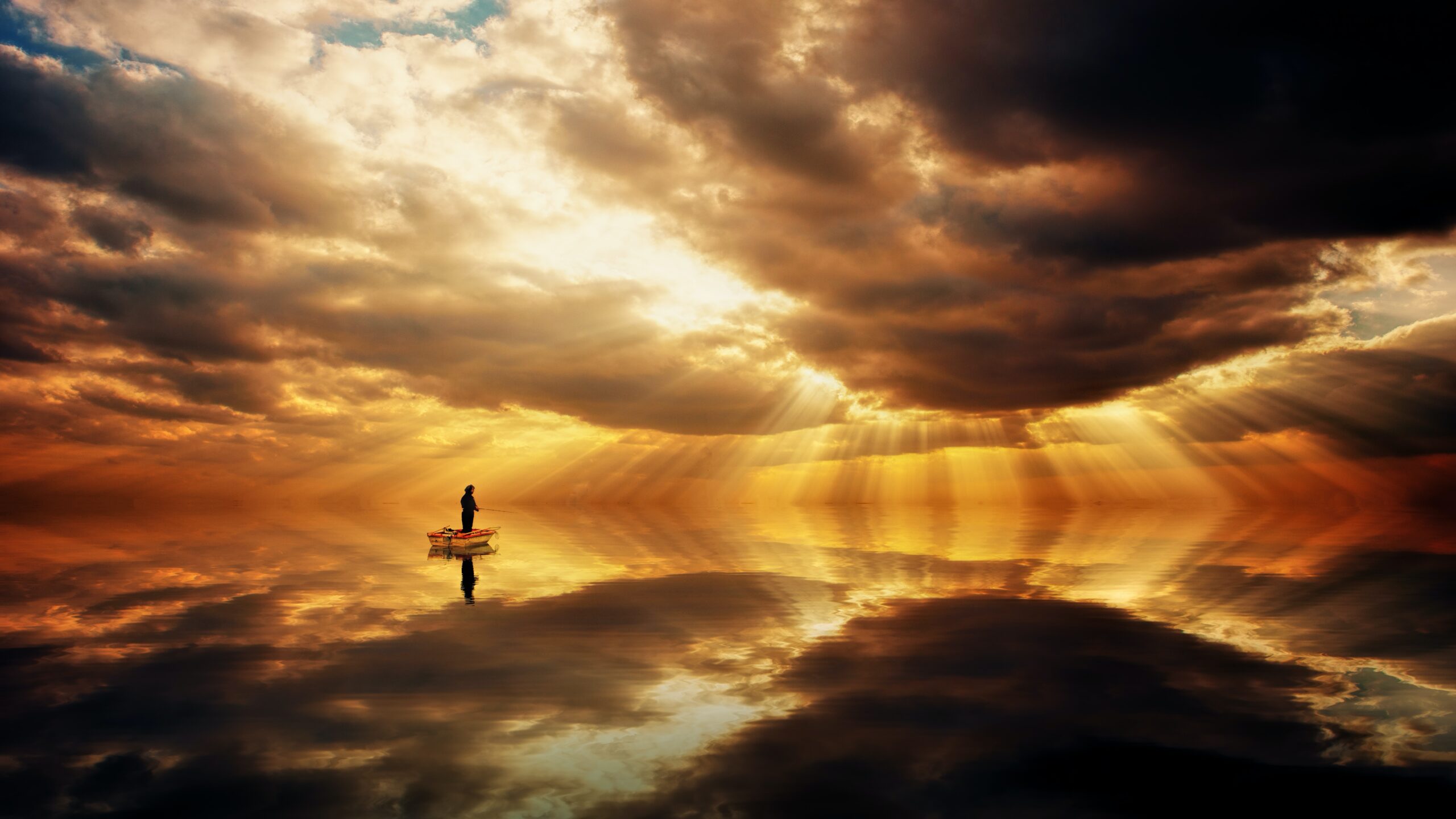 Fisherman in dawn sky