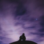 Person staring at night sky