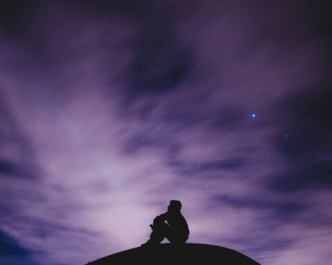 Person staring at night sky