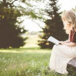 Girl reading BIble in garden