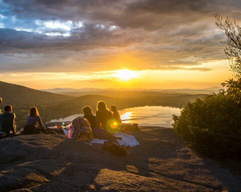 Group of people watching a sunset