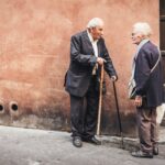 Elderly couple talking on street